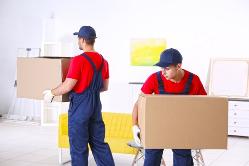 Man with van loading household items for transport