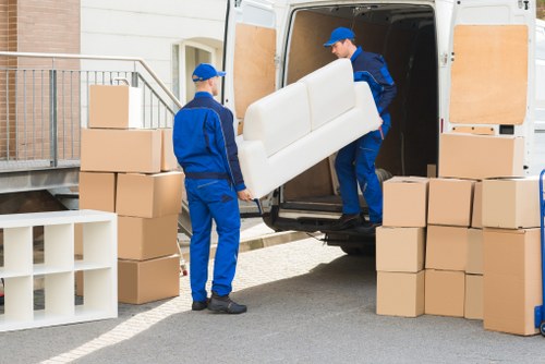 Packed moving boxes and furniture ready for a house move