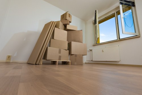 Office removals team preparing desks and boxes for a move in Osidge