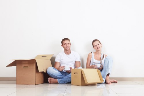 Professional movers loading items for a business relocation in Osidge