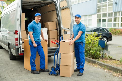 Professional movers handling office furniture near Osidge