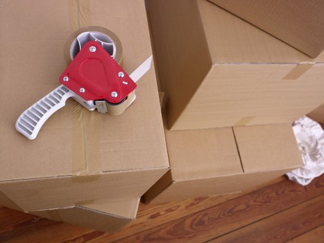 Packed household boxes loaded for a move in Osidge