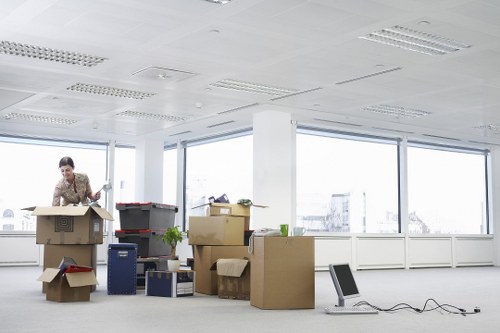 Commercial office items being moved by a removals crew
