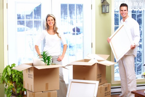 Professional movers handling furniture during an Osidge house move
