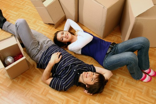 Packed moving boxes and furniture ready for removal service